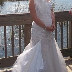 Strapless white trumpet wedding gown